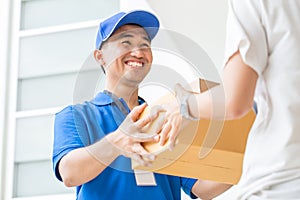 Woman accepting a delivery boxes from deliveryman