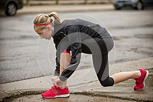 Woman adjusting her shoe