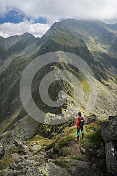 Woman admiring the amazing view in the mountains