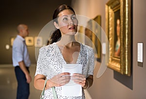 woman admiring art work