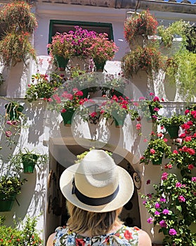 Woman admiring flowers in Andalusia, Spain