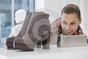 Woman admiring footwear in store