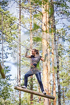 Woman in adventure rope park