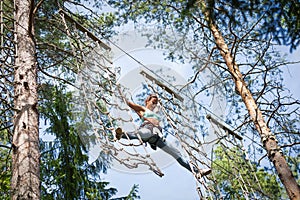 Woman in adventure rope park