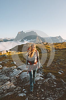 Woman adventurer hiking in mountains travel vacation healthy lifestyle