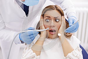 Woman afraid at dentist office