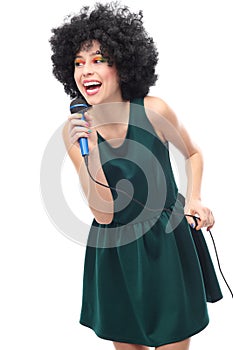 Woman with afro hairstyle holding microphone