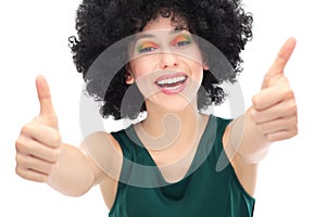 Woman with afro showing thumbs up