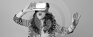 Woman against background in virtual reality headset