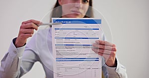 Woman agent showing how to fill out insurance form closeup 4k movie slow motion