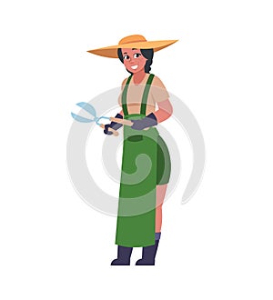 Woman agricultural worker. Cute girl stands with pruner, female grows vegetables flowers, take care of fruit trees photo