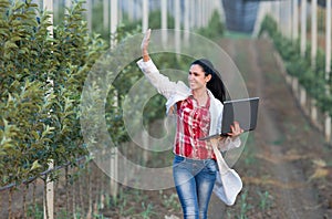 Woman agronomist in orchard