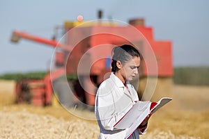 Woman agronomist in wheat field