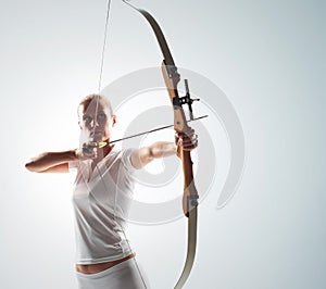 woman aiming with bow