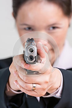 Woman aiming a hand gun