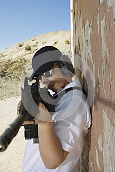 Woman Aiming Machine Gun At Firing Range