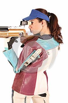 Woman aiming a pneumatic air rifle