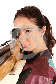 Woman aiming a pneumatic air rifle