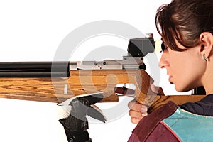 Woman aiming a pneumatic air rifle