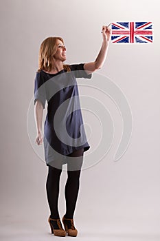 Woman air-draws English flag, emphasizes global language photo