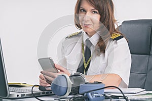 Woman airline pilot at the office