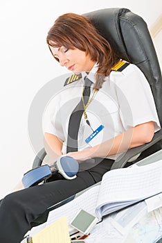 Woman airline pilot sleeping in the office