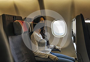 Woman in a airplane with face mask protection, coronavirus COVID19 virus