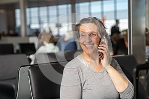 Woman at an airport waiting for flight