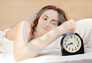 Woman and an alarm (focus on alarm)