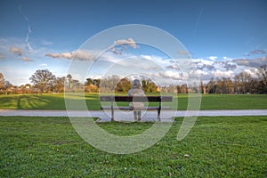 Woman alone on park bench