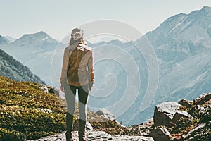 Woman alone standing in mountains wander landscape photo