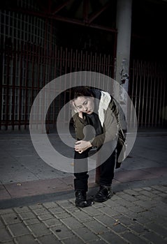 Woman alone on street suffering depression looking sad desperate and helpless