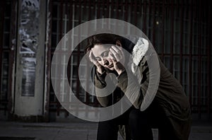 Woman alone on street suffering depression looking sad desperate and helpless