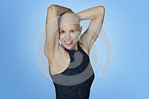 Woman with alopecia posing in studio without hair