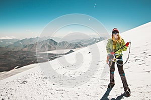 Woman alpinist mountain climbing glacier photo