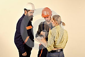 Woman amend plan of repair. Supervisor not satisfied with renovation. Misunderstanding concept. Brigade of workers photo