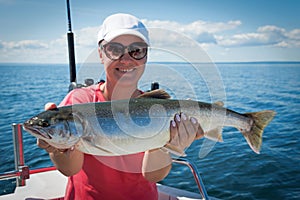 Woman angler with arctic char