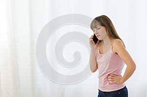 Woman angrily talking on phone