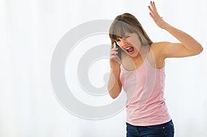 Woman angrily talking on phone