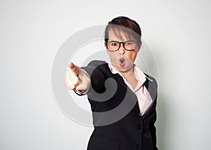 Woman angry. Shouting and pointing finger hand forward. Emotional portrait background.