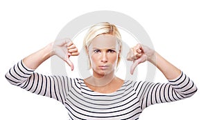 Woman, angry and thumbs down with review in portrait, body language or disagreement with fail on white background. Hand