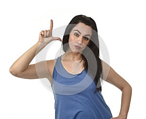 Woman angry upset and sad doing L sign with her fingers representing looser