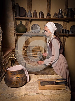 Woman in antique kitchen