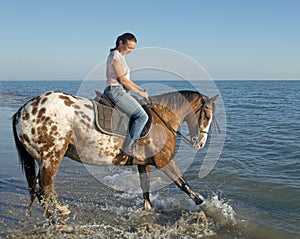 Woman and appaloosa horse