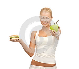 Woman with apple and hamburger