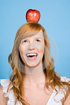 Woman with an apple on her head