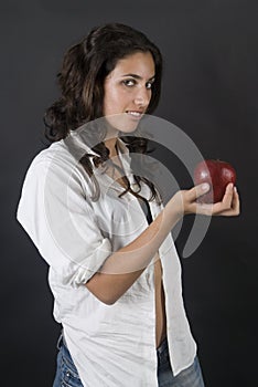 Woman with apple and money in a temptation