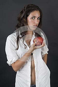 Woman with apple in a temptation