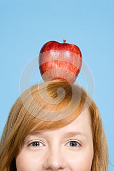 Woman with an apple on top of her head