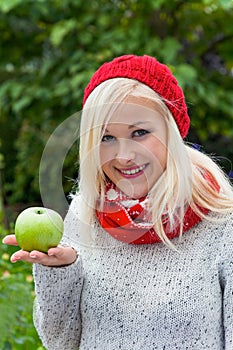 Woman with apple. vitamins in autumn